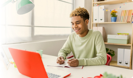 ACT student with and ornage laptop